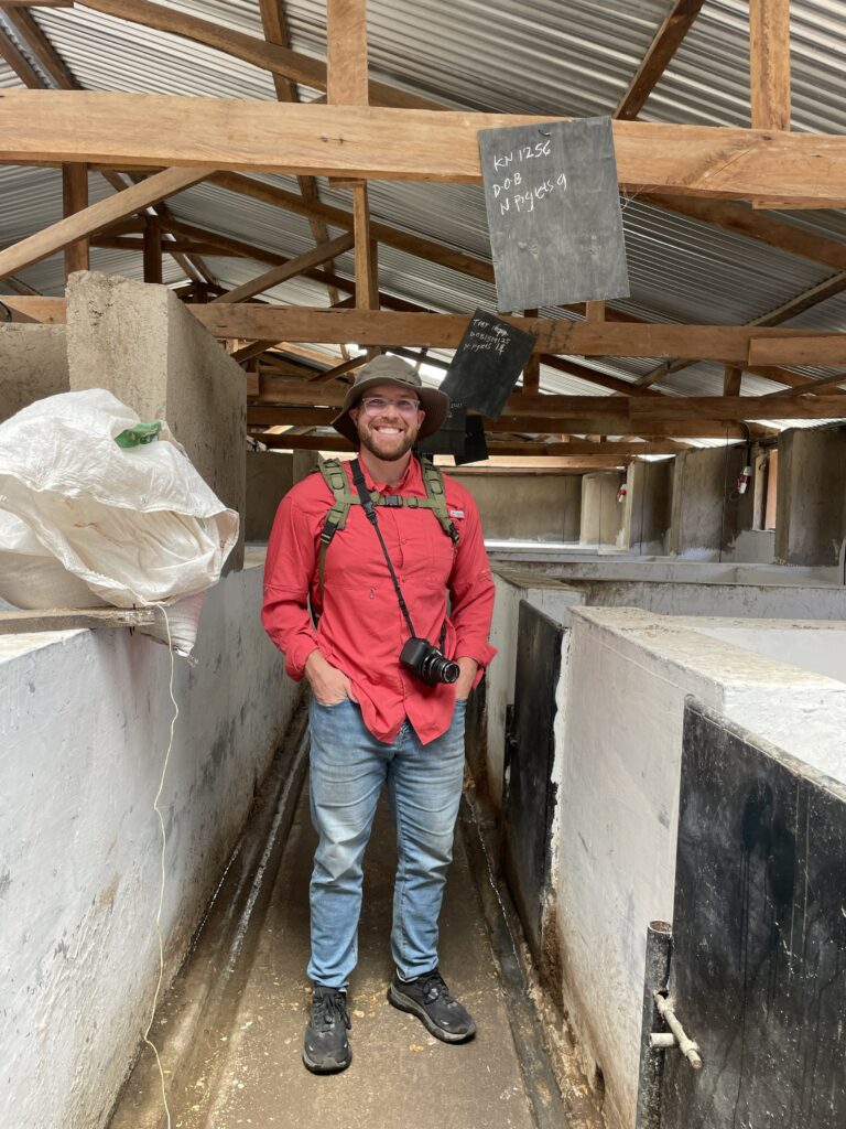 Man with camera in barn