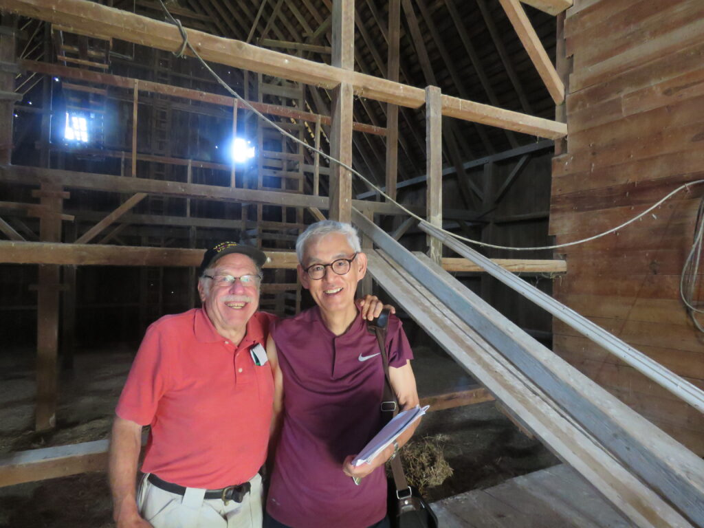 two men in a barn in Iowa